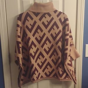 Turtleneck short sleeve knit poncho sweater.